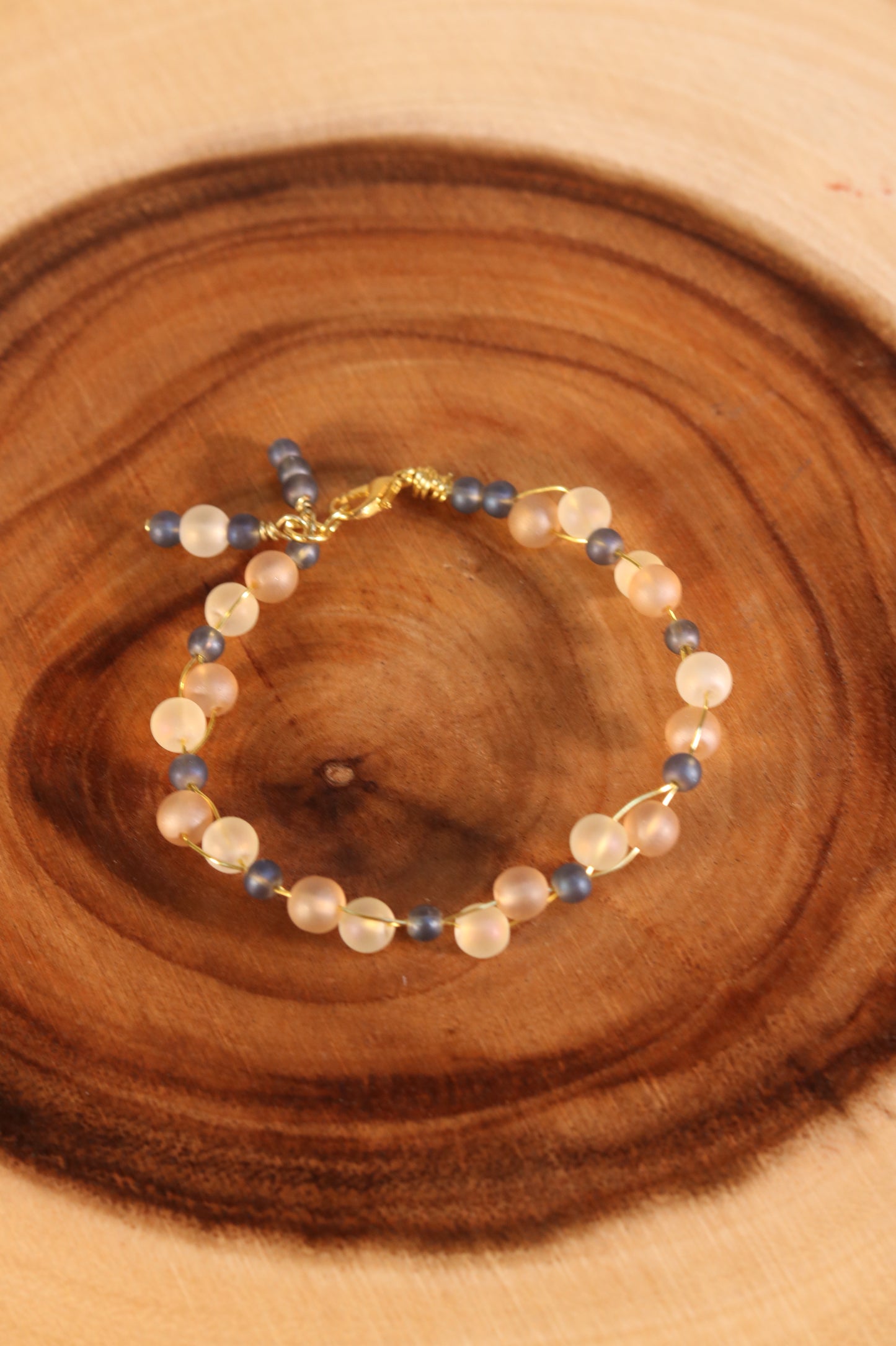 Gold Wire Bracelet with Blue and Opaque Beads