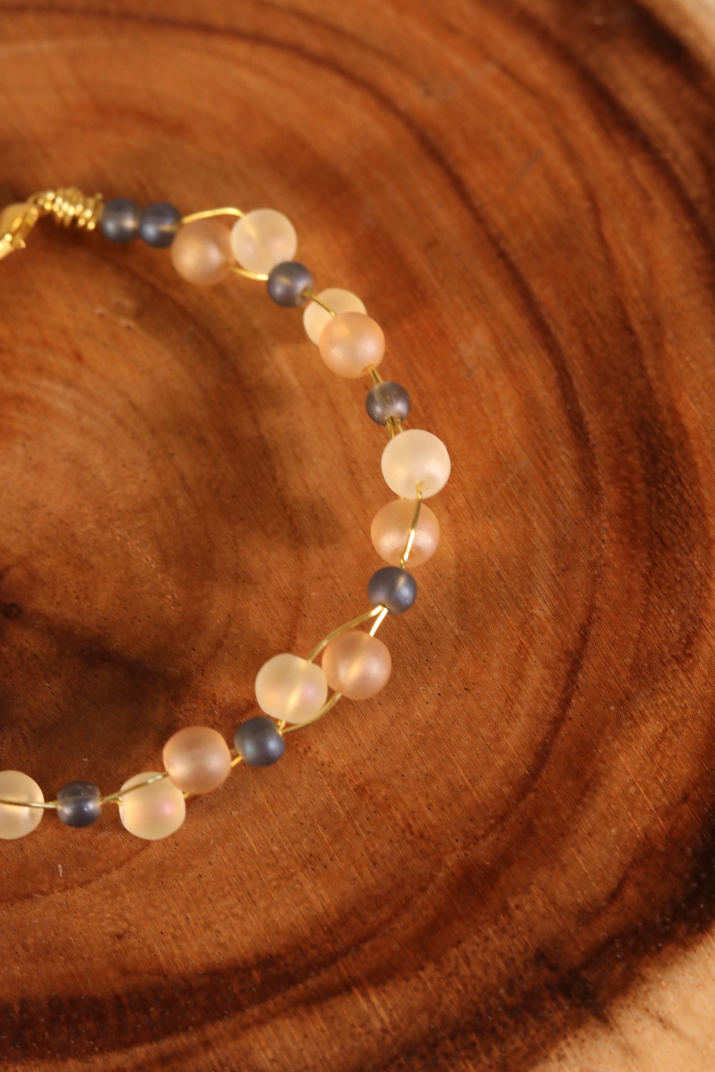 Gold Wire Bracelet with Blue and Opaque Beads